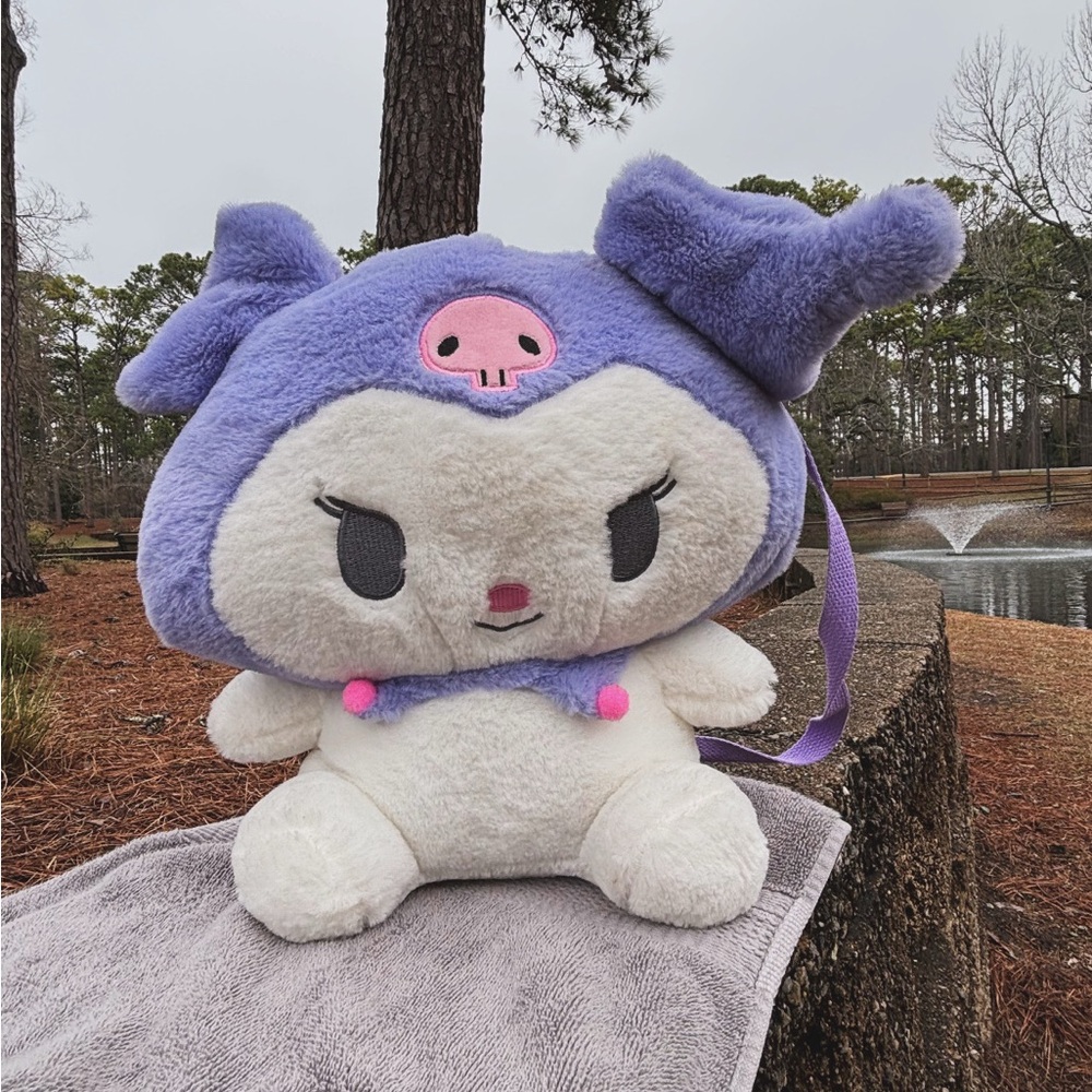 Others Follow Purple and White Stuffed Animal